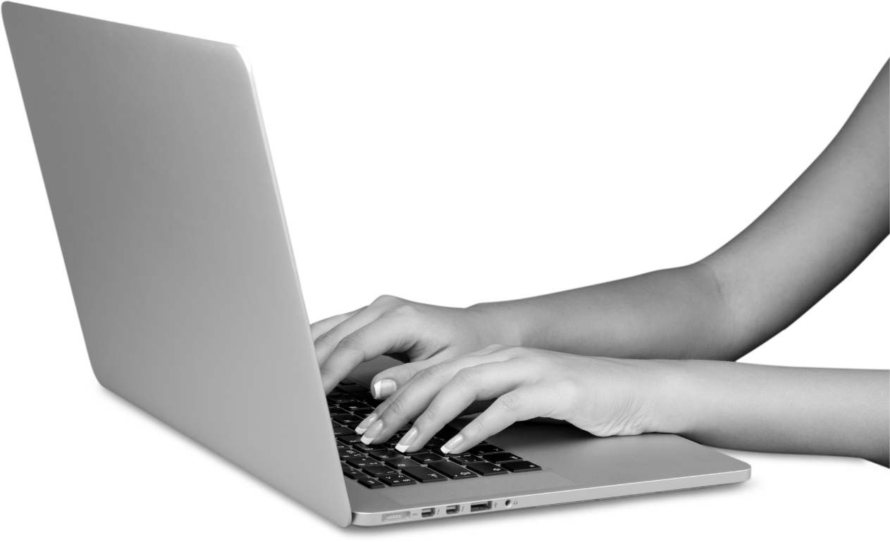Hands typing on a laptop